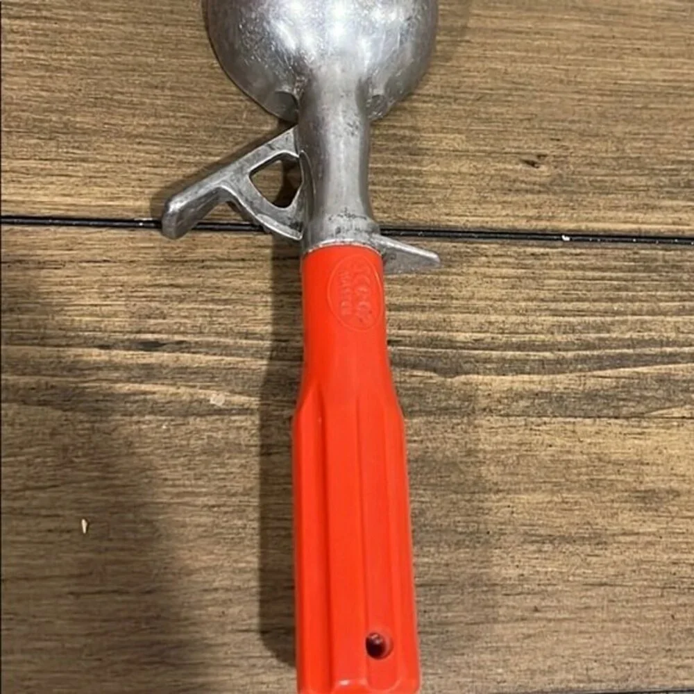 Vintage scoop master ice cream scoop with red handle